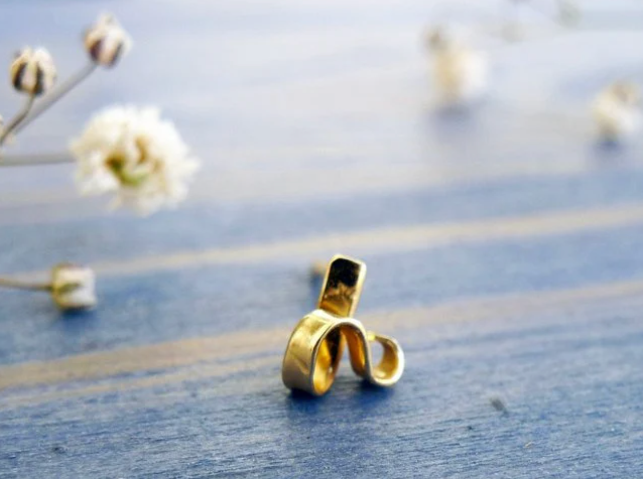 tiny gold stud shape by hand as a ribbon. 14K solid gold stylish unique earring