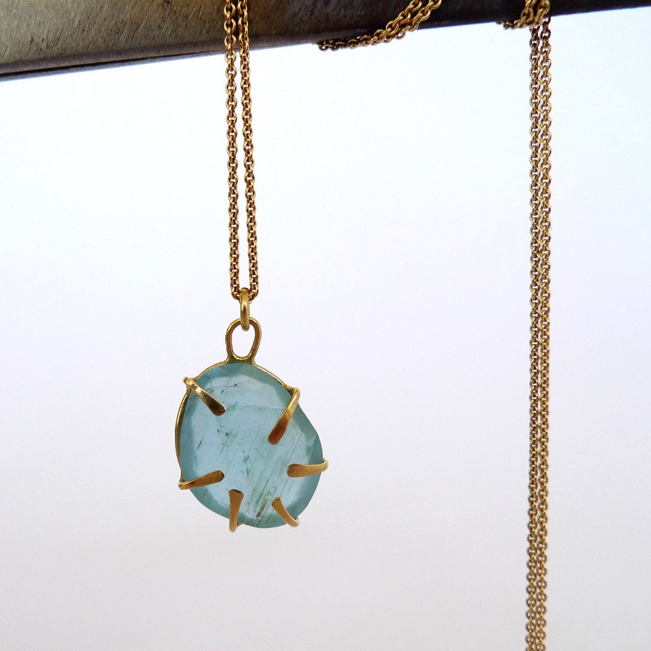 Aquamarine Wrapped In Gold