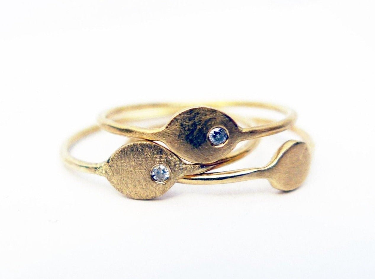 eye shape dainty thin asymmetrical diamond ring 14k recycled solid gold and clear natural diamond handmade rustic finish evil eye protection symbol alternative solitaire