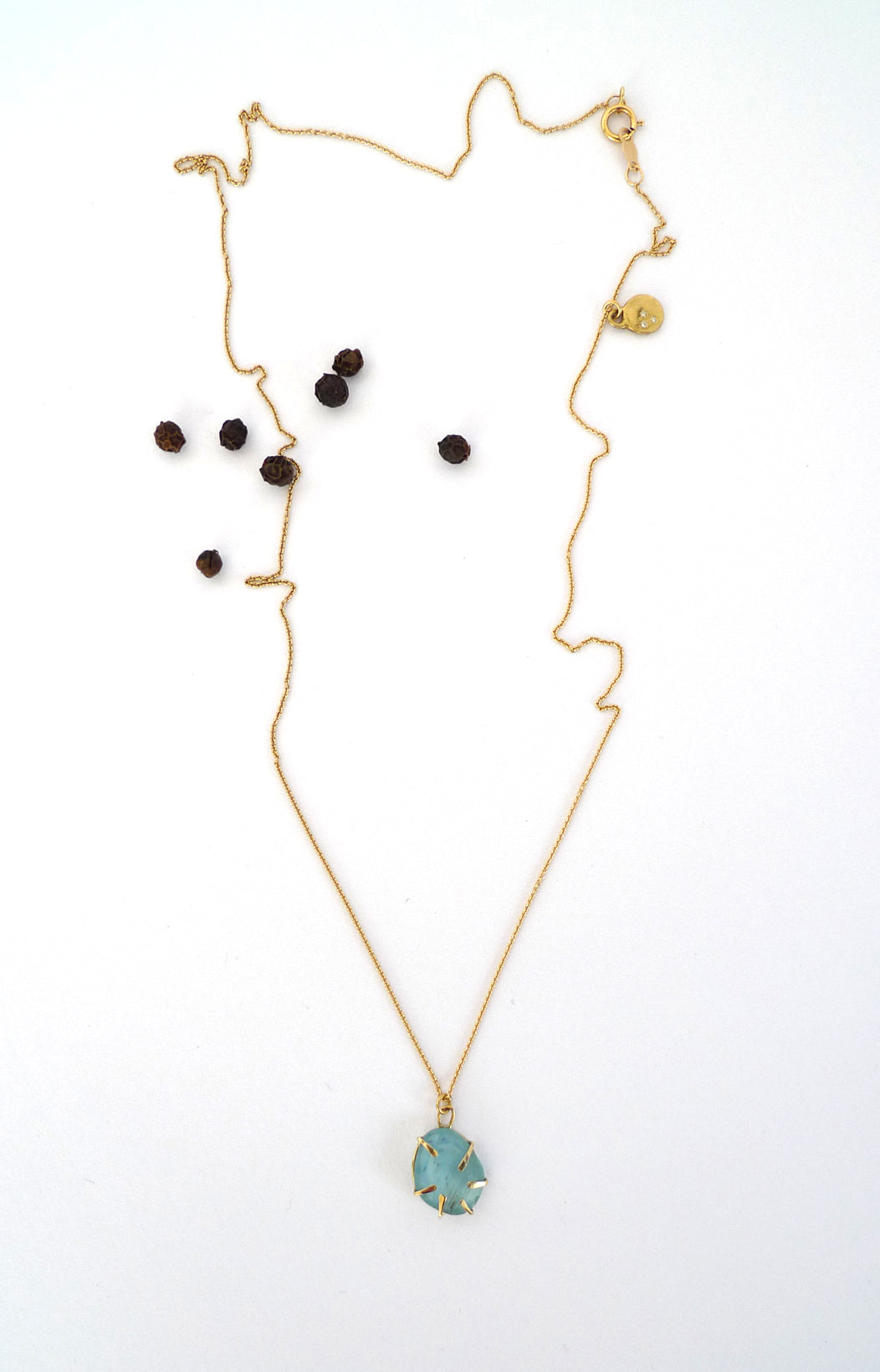 Aquamarine Wrapped In Gold