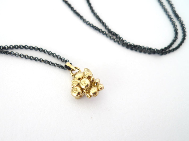 nugget gold chunky asymmetric 9k solid gold abstract pendant on blackened silver chain