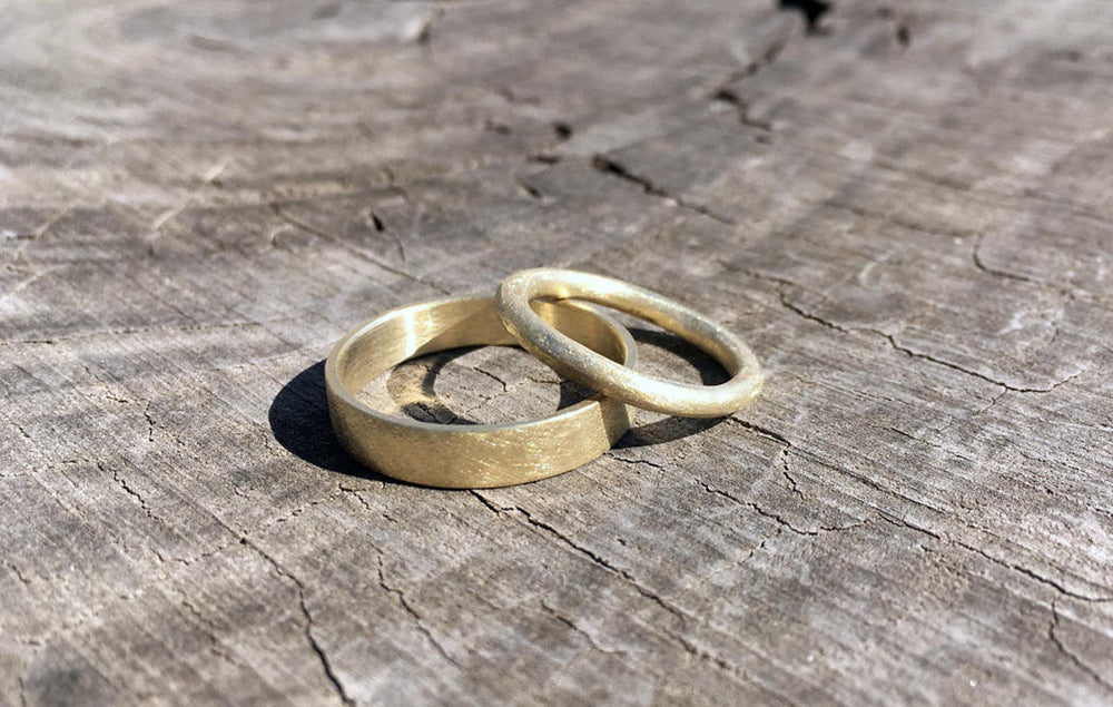 Handmade 100% recycled solid 14K gold wedding band set. Organic fine stylish unisex gold rings. Proposal alternative rustic gold rings. Antique inspired wedding rings for man and woman.