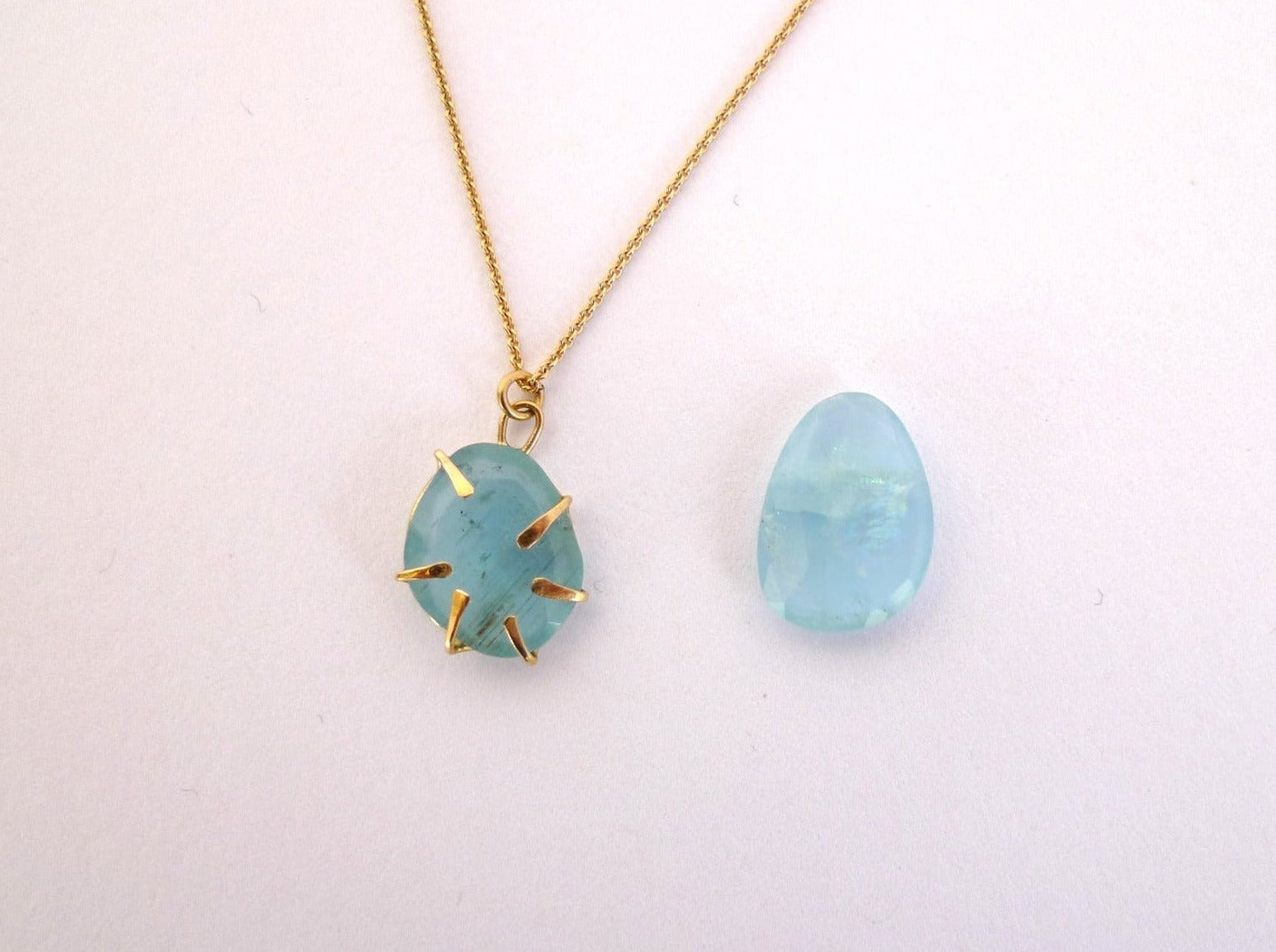 Aquamarine Wrapped In Gold