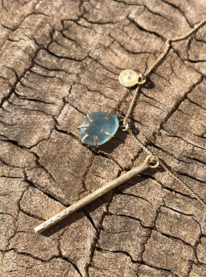 Aquamarine Wrapped In Gold