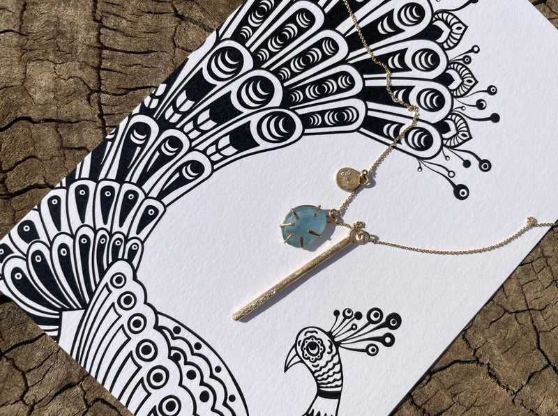 Aquamarine Wrapped In Gold