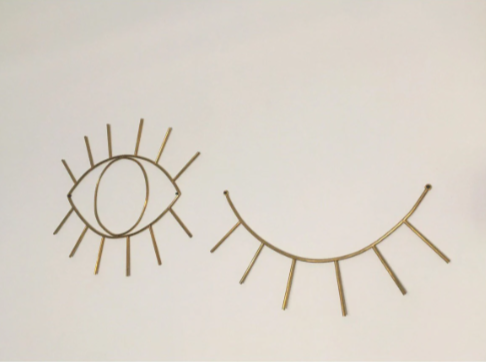 good luck wall decor open eye and closed eyelet. past and future conceptual wall jewelry. brass home jewelry handmade sculptural design for the room.