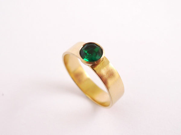 Sustainable fine jewelry unisex flat 5mm comfort fit 14k recycled gold ring set with giant central solitaire brilliant cut lab grown green emerald stone