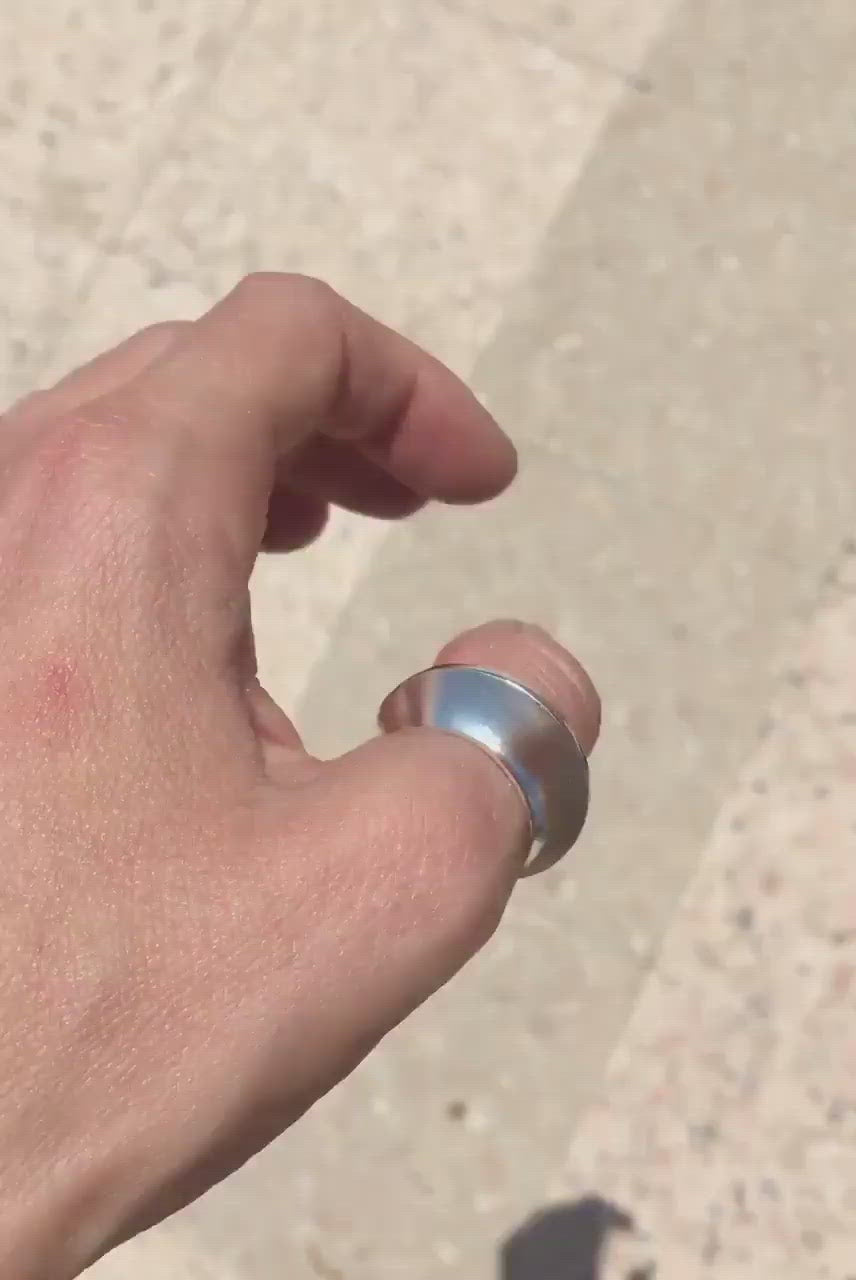 large statement asymmetrical shiny silver ring