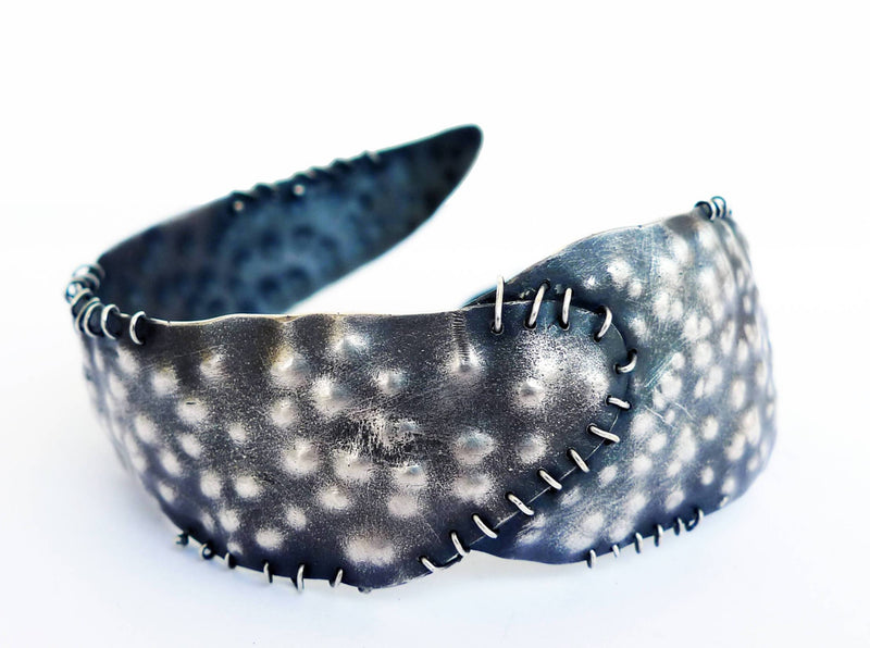 unique dark alternative blackened rustic artisan open cuff large bracelet hammered bumps dots and scrached textured wide flexible adjustable open cuff with sewing details of silver wire. all handmade from Sterling silver.