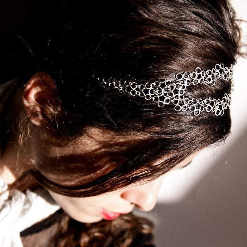 unique artisanal head piece tiara made of silver elements attached together. 100% recycled silver and adjustable band on the back. modern royalty cool necklace headband