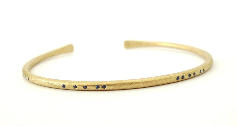 secret morse code gold cuff bracelet open full 14ct recycled gold handmade rustic textured finish set with tiny brilliant cut sapphires in a morse code array