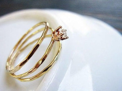 handmade unique dainty coiled wrap gold ring. recycled 14k solid gold diamond solitaire brilliant cut 13 points clear diamond. split thin handmade artisanal engagement ring