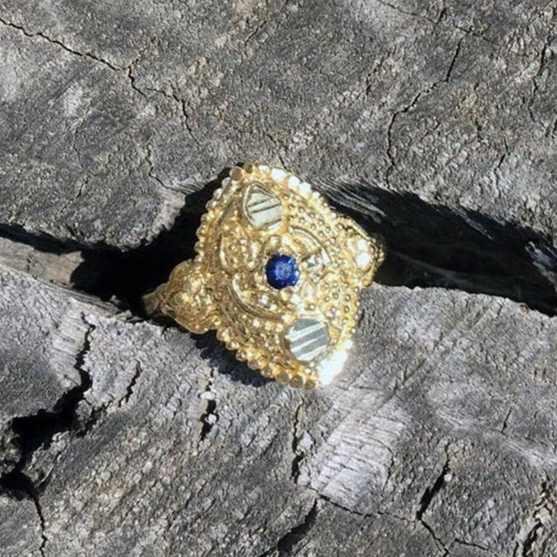 dainty boho chic antique orient style recycled 14 / 18 karat gold ring set with natural blue sapphire. ornament details granulated eye shape gold ring. evil eye protection unique eastern design.